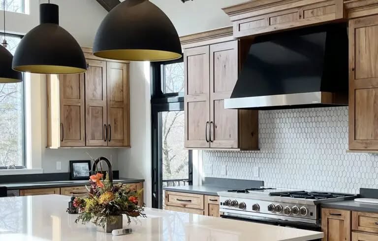 Wood kitchen with black range hood