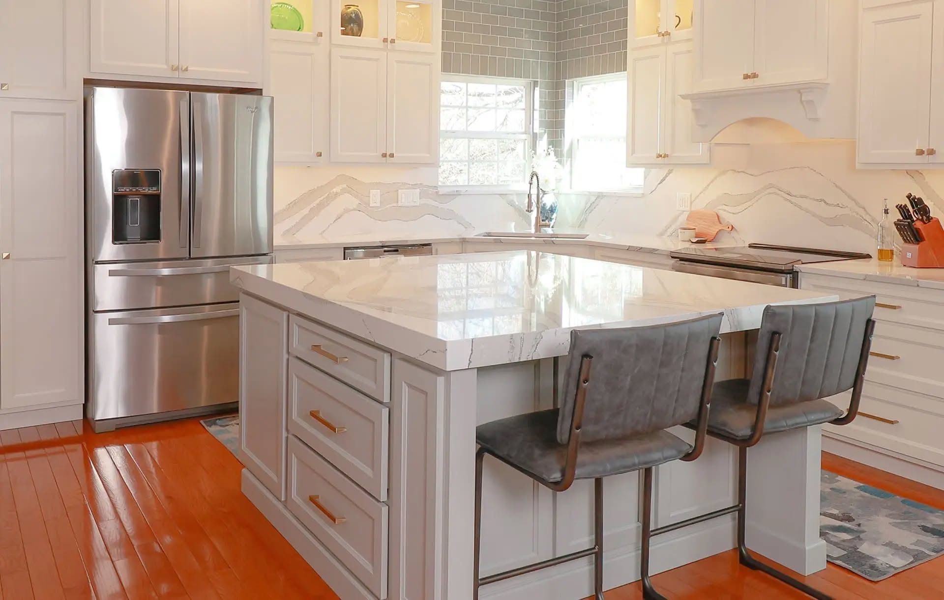 White kitchen with marble-look island countertop